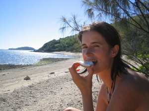 Eating fresh coconut at Sandy Bay