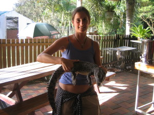 Regina hugging a baby crocodile