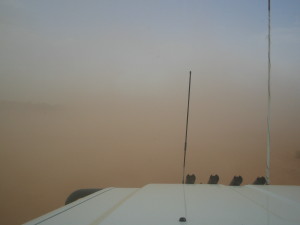 Outback driving with dust storm