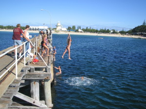 Kids jumping from Busselton Jetty